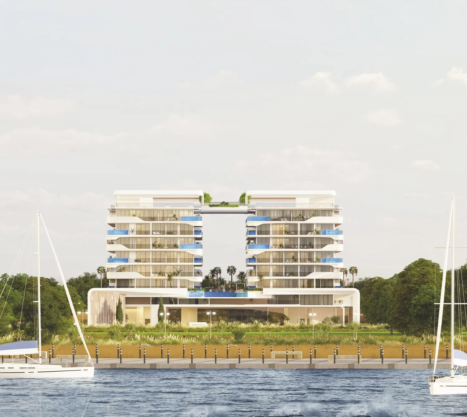 Waterfront residences on Dubai Islands with sailing boats moored in front